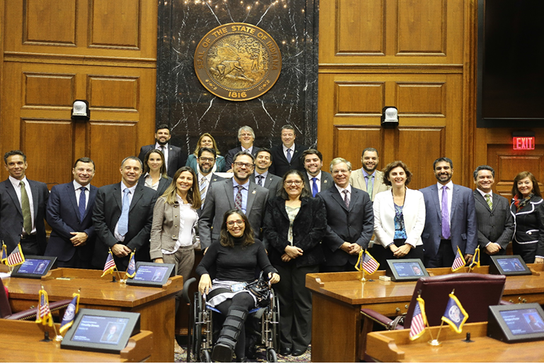 Claudia Avellaneda and a group of LEAP students in the Indiana Statehouse.