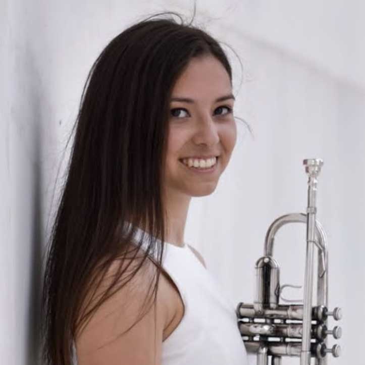 Smiling woman with trumpet. 